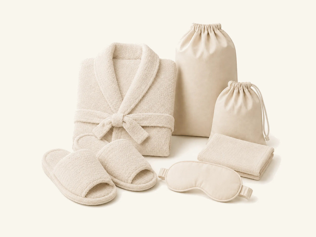 Private-label terry bathrobe, slippers, wash cloth, sleep mask, laundry bag and hair dryer bag
