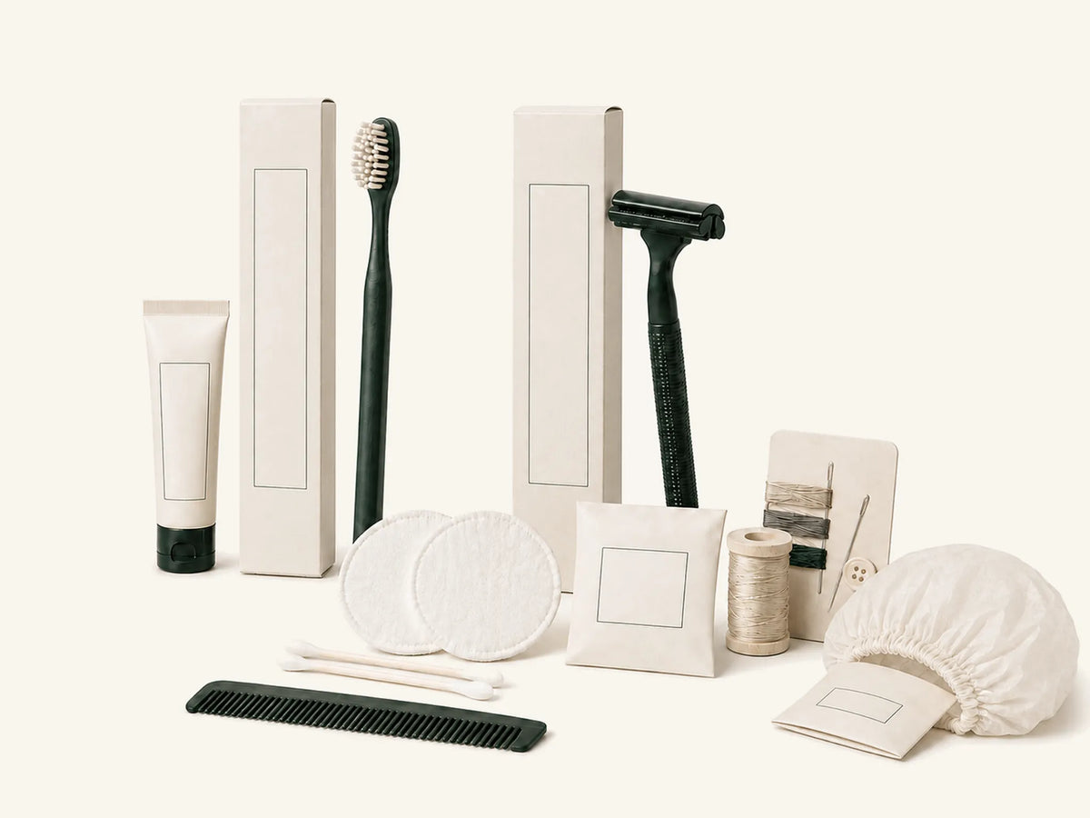 Private-label dry amenity kits including dental, shaving, vanity, sewing, comb and shower cap items